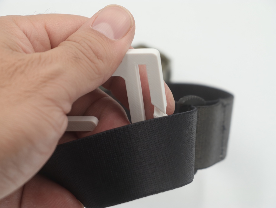 BrightHook positioned inside the adjustment buckle, hook facing down